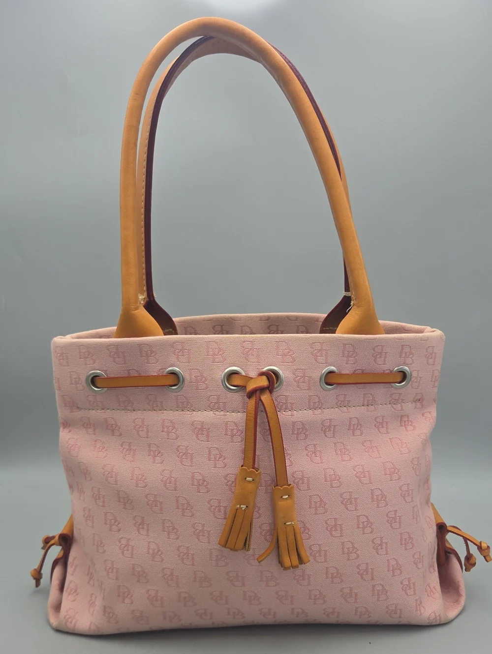 Dooney Bourke DB Monogram Drawstring Tote Canvas Leather Tassel Pink